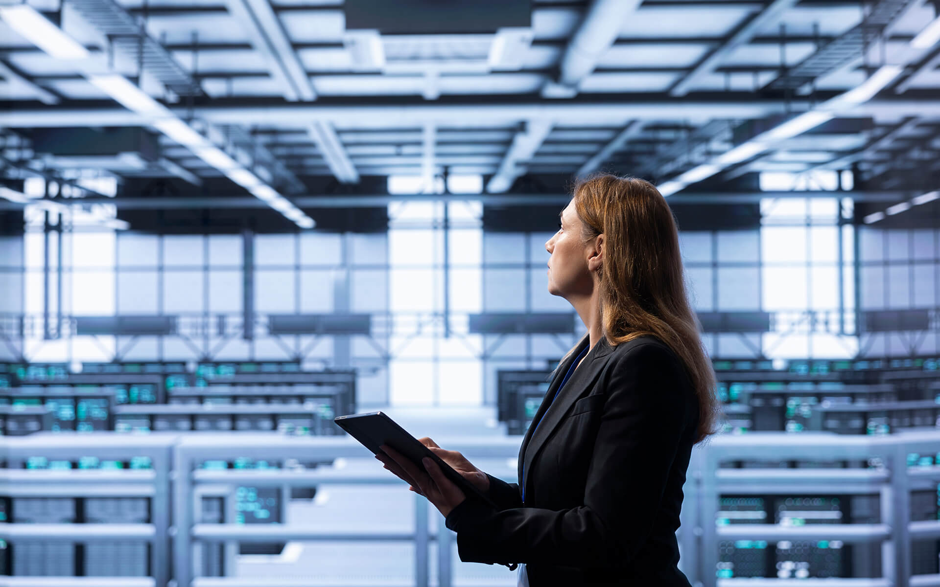 Female IT expert in server room.