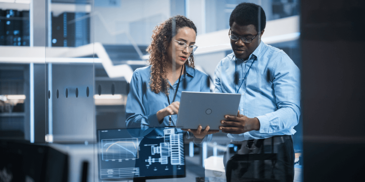 Multiethnic Robotics Engineer Talking to Project Manager, Discussing Robot Dog Concept in High Tech Research and Development Facility.