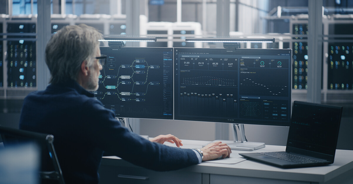 Security analyst monitoring audit logs, system activity, and cloud infrastructure dashboards.