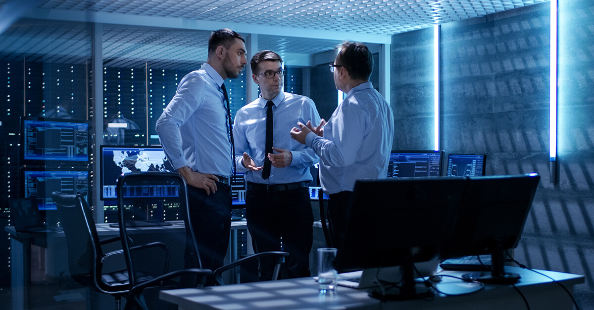 IT professionals reviewing security operations, compliance controls, and monitoring processes.